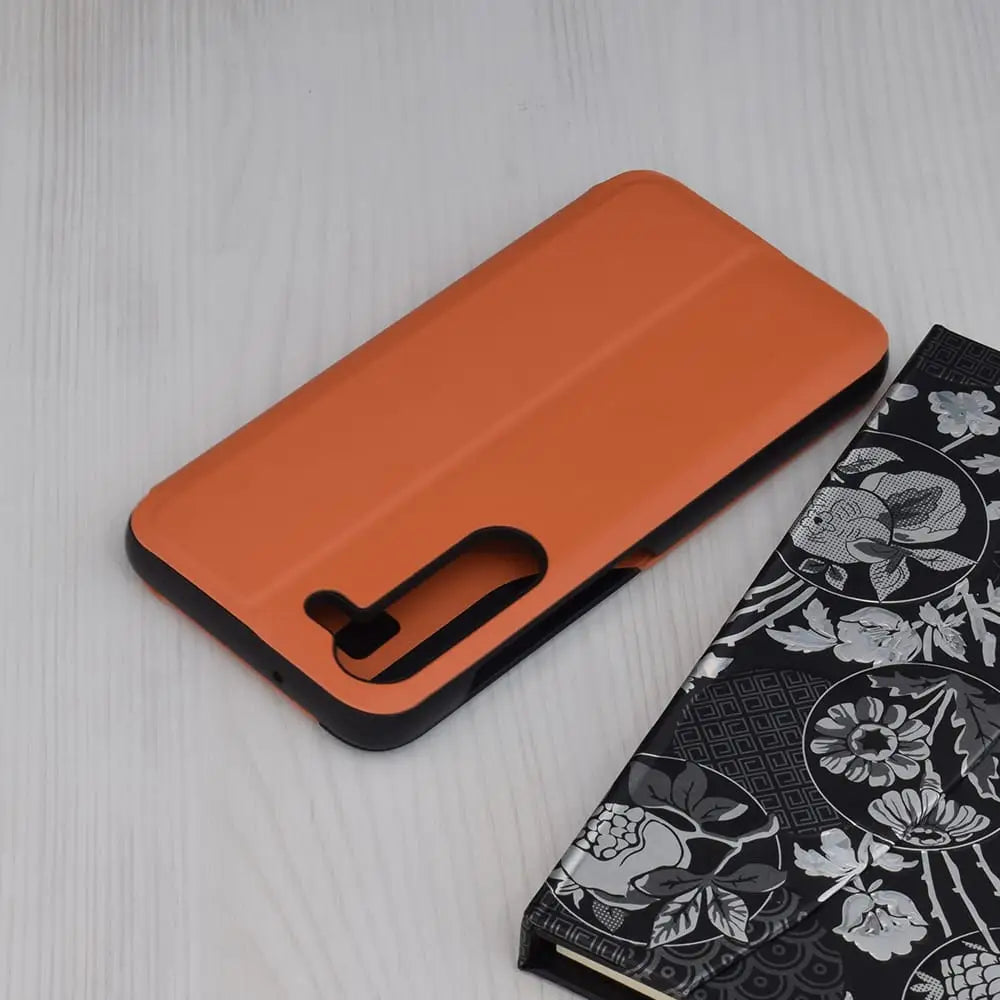 Oranssi suojaava puhelimen kuori Samsung Galaxy S23 - Flip suojakuori mustilla reunoilla